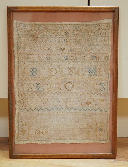 A framed sampler dated 1843, 31 x 24cm. Condition - poor to fair